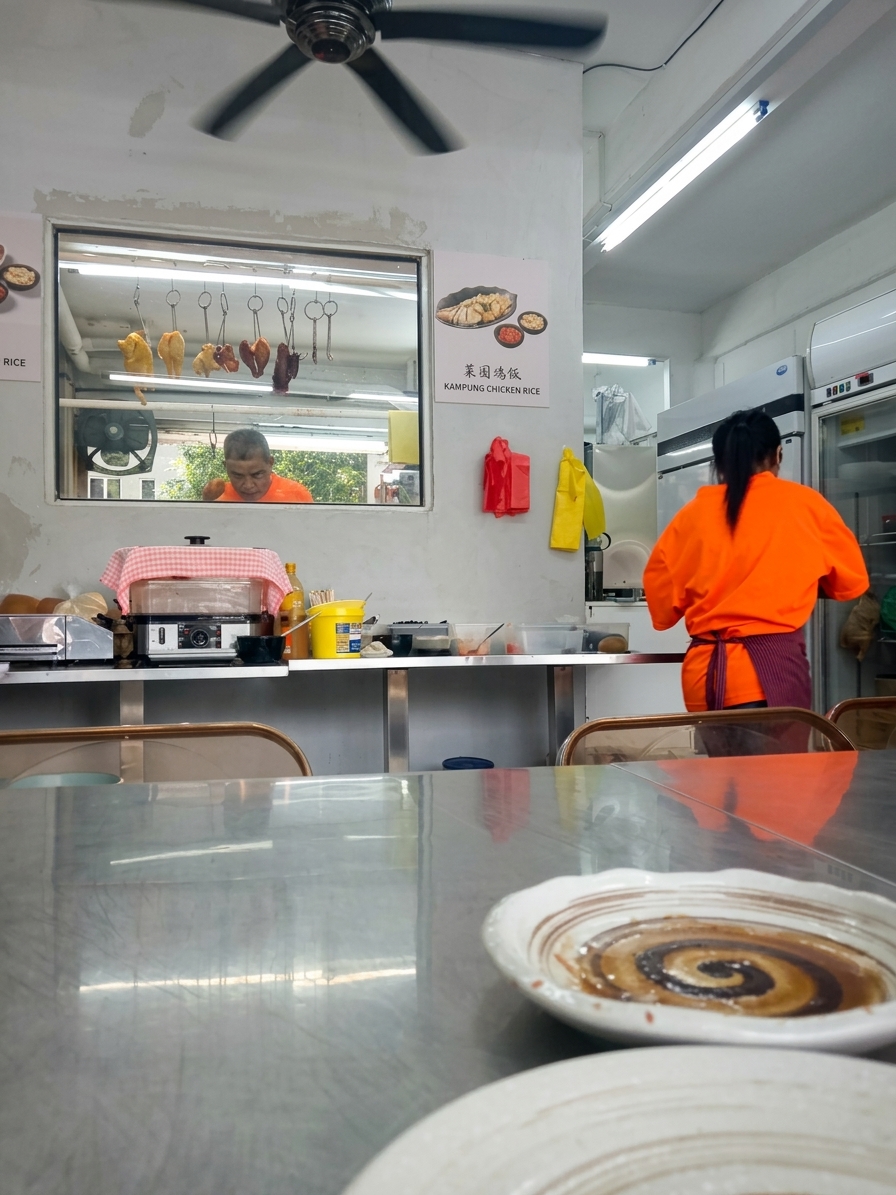Kopitiam interior with chef and ceiling fan in Pudu